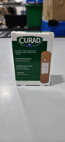CURAD FABRIC ANTIBACTERIAL BANDAGE, OUCHLESS MEDICATED PAD, 30 BANDAGES - Brand New