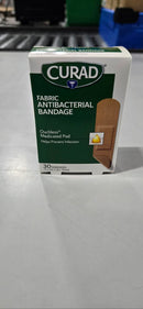 CURAD FABRIC ANTIBACTERIAL BANDAGE, OUCHLESS MEDICATED PAD, 30 BANDAGES - Brand New