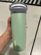 OWALA 30OZ FREE SIP STAINLESS STEEL WATER BOTTLE LIGHT GREEN WITH TAN TOP OF LID - Like New